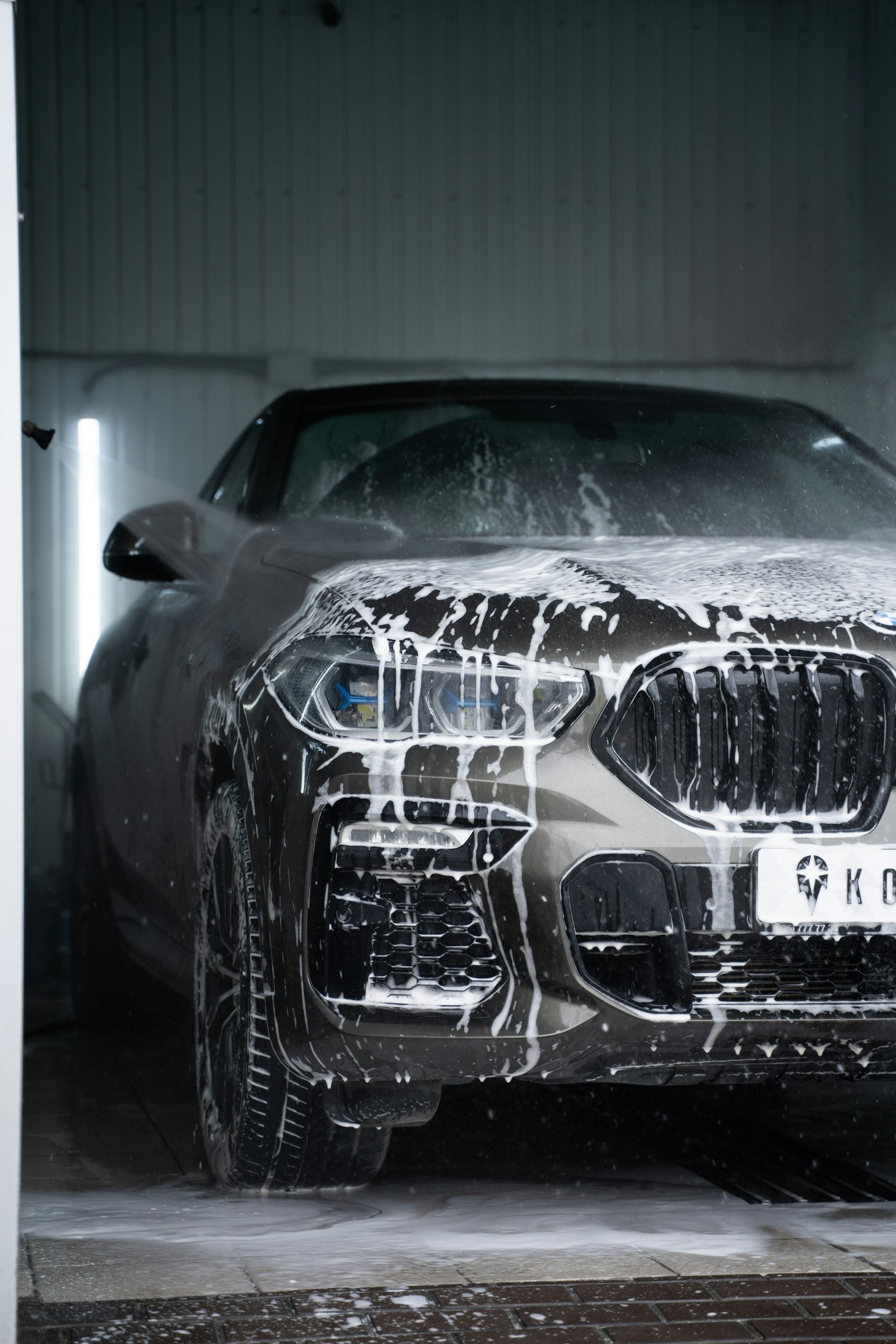 http://Car%20covered%20in%20foam%20inside%20an%20express%20wash%20tunnel