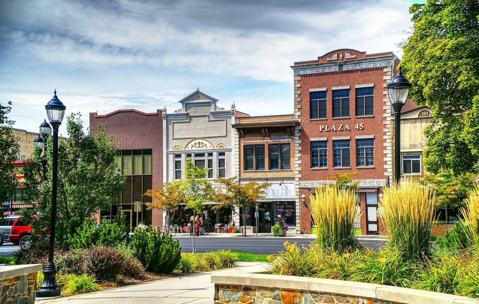 Brick building with a clock on a small town main street