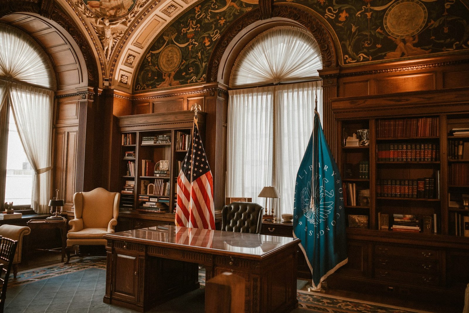 Law office with bookshelves and flags