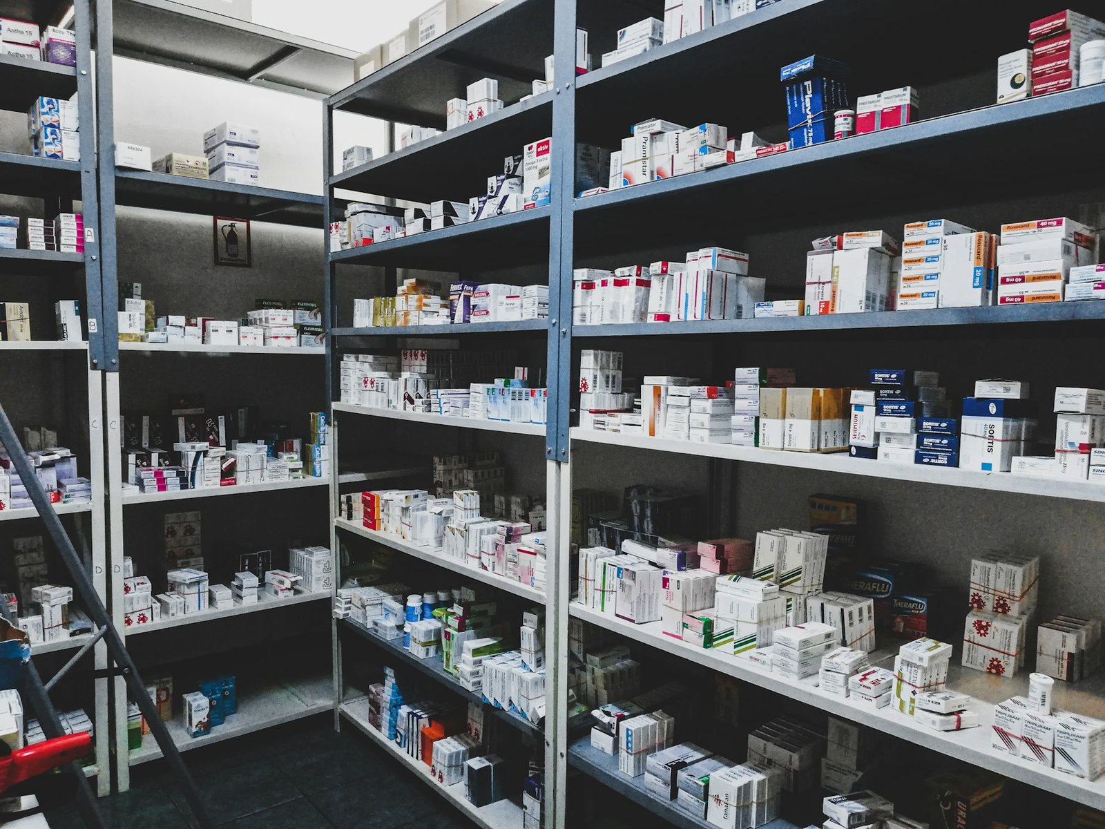 Pharmacy shelves stocked with medicine