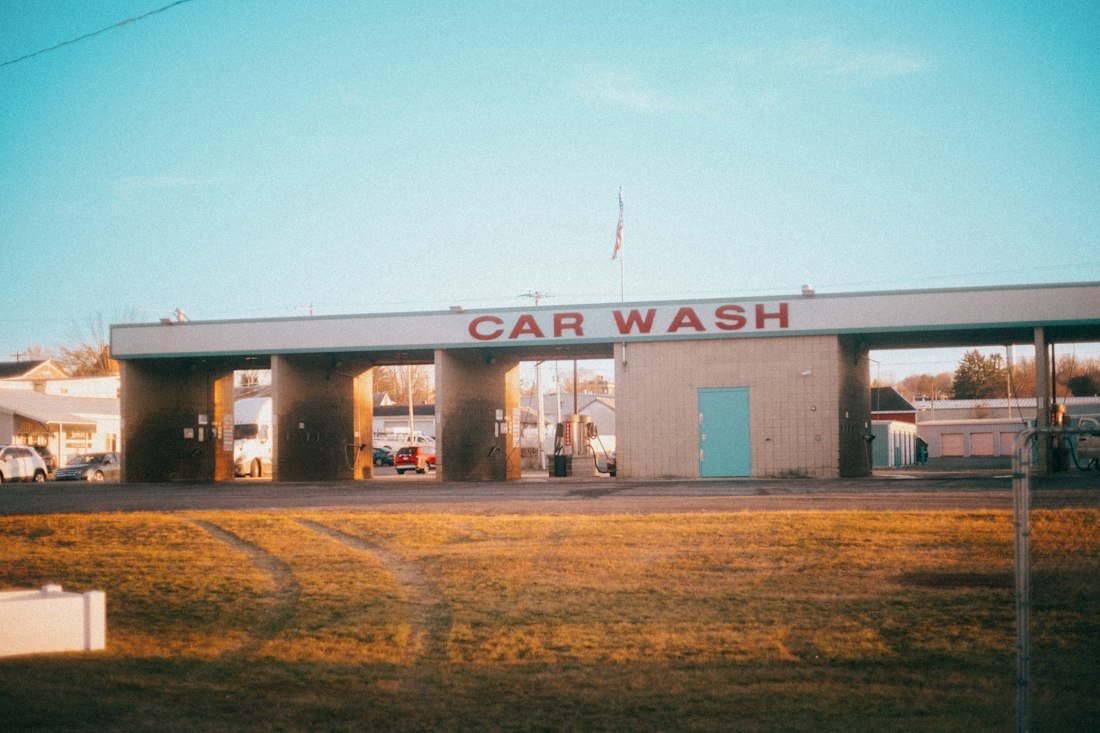 A car wash with cars parked in front of it