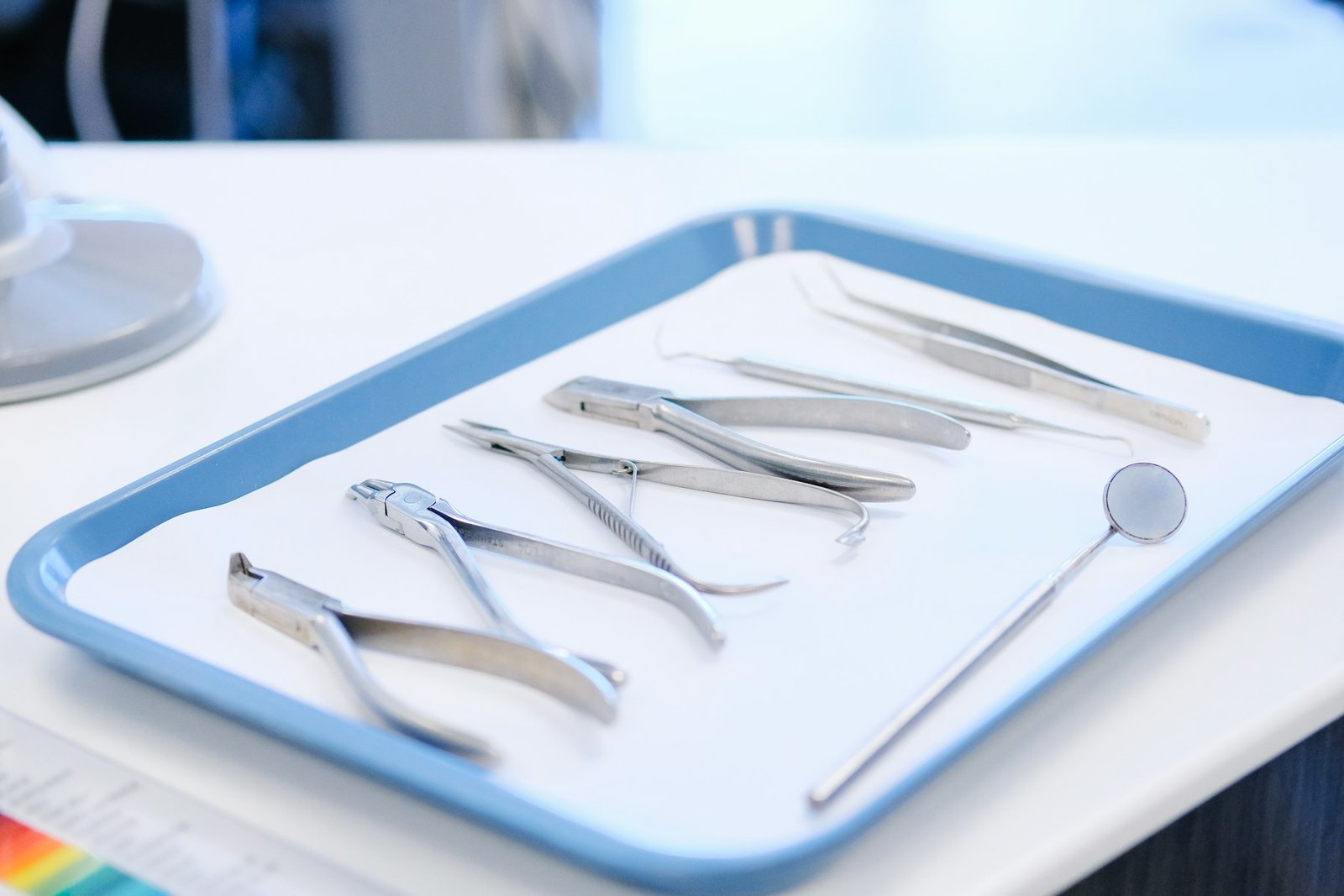 Dental instruments laid out on a tray