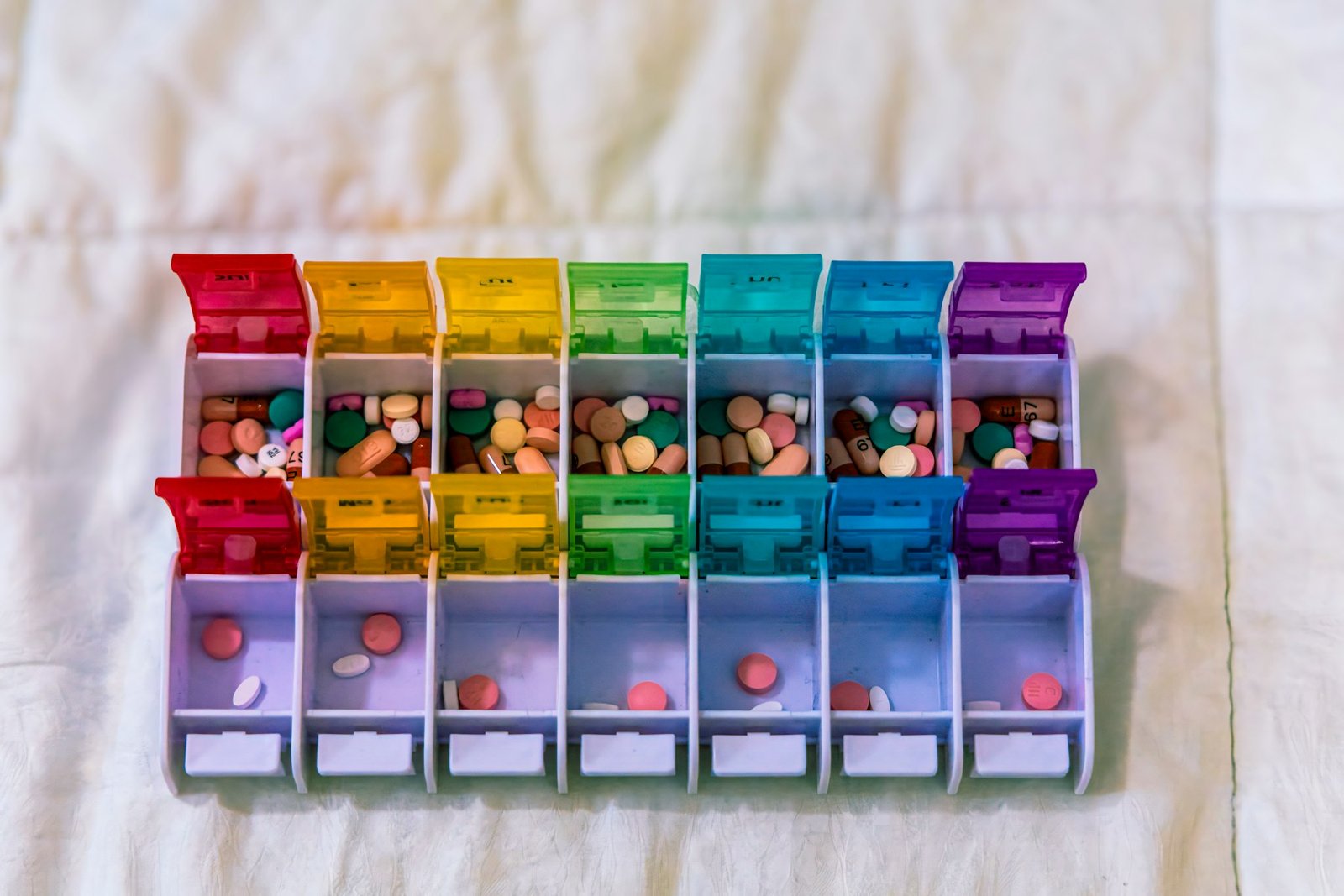 Colourful weekly pill organiser