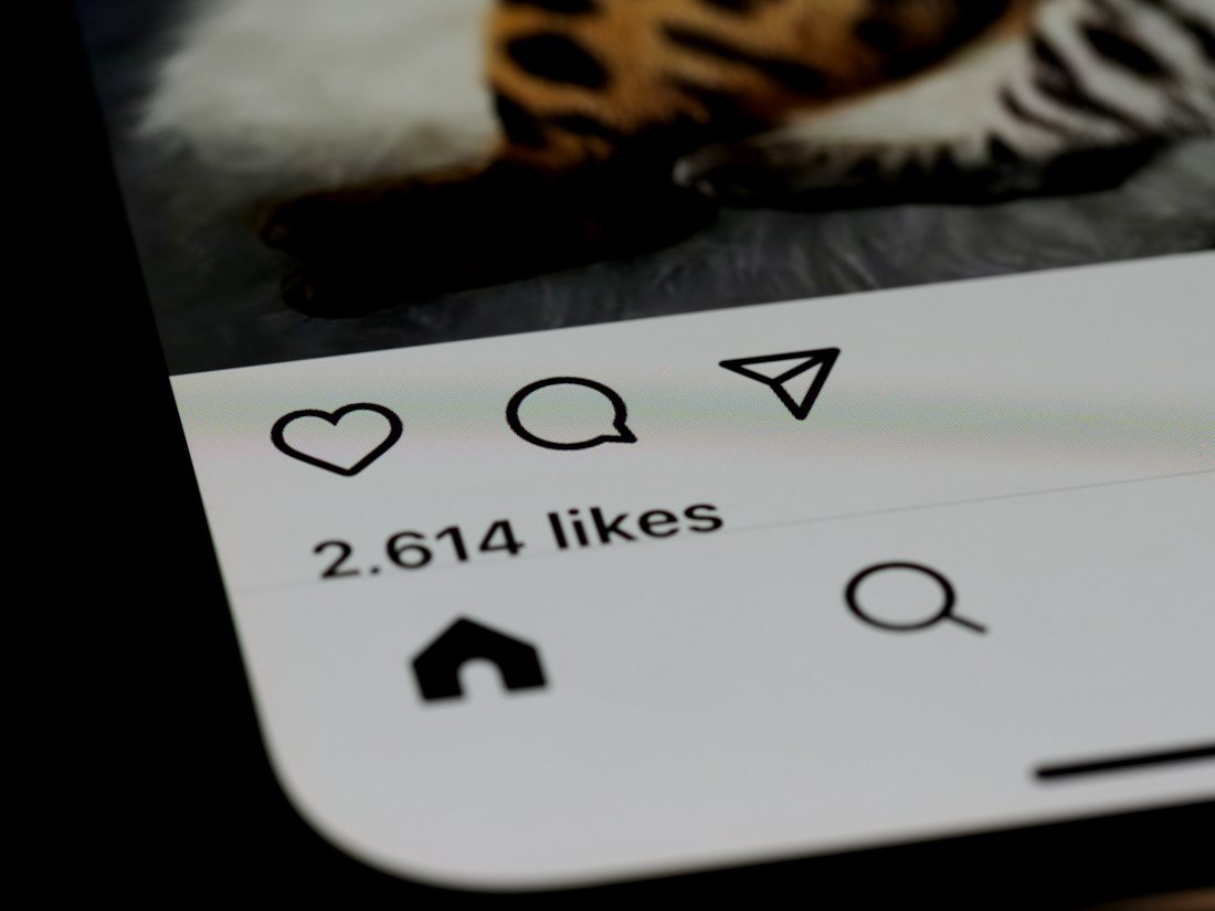 Social media post showing likes on a phone
