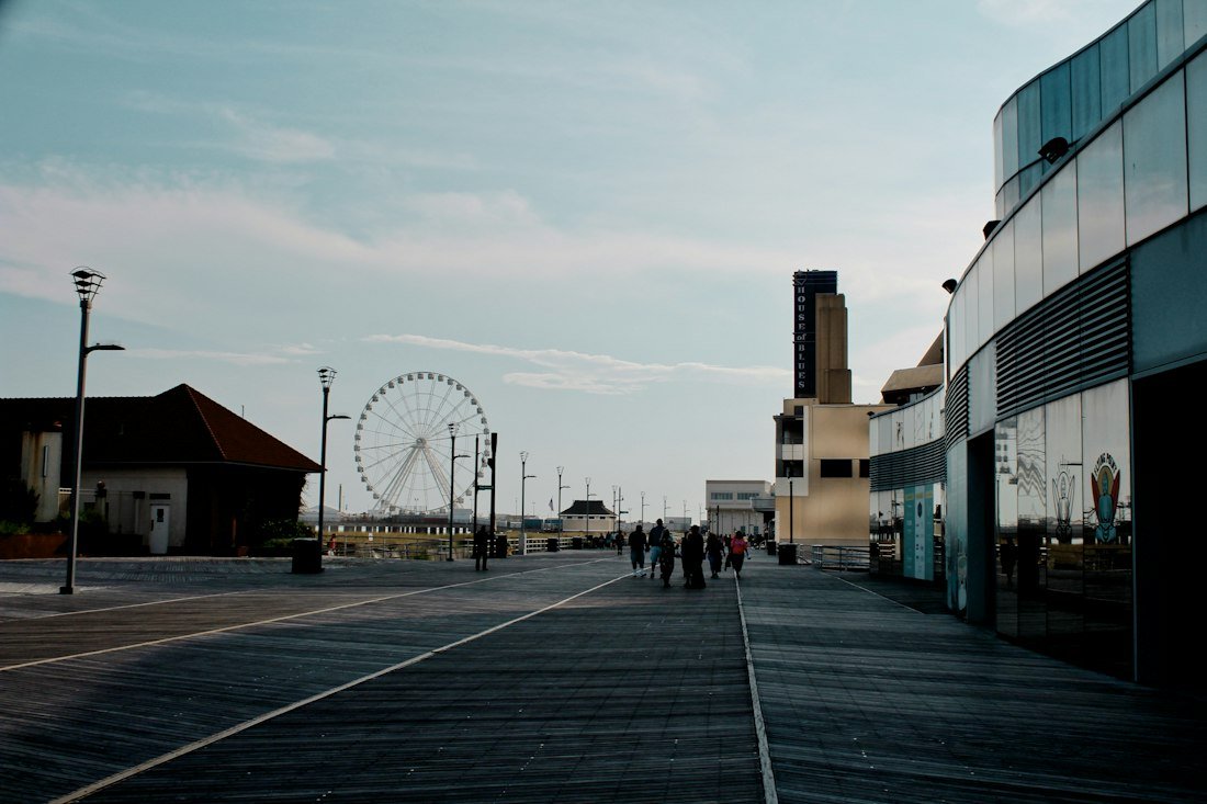 Gray concrete structure near Ferris wheel