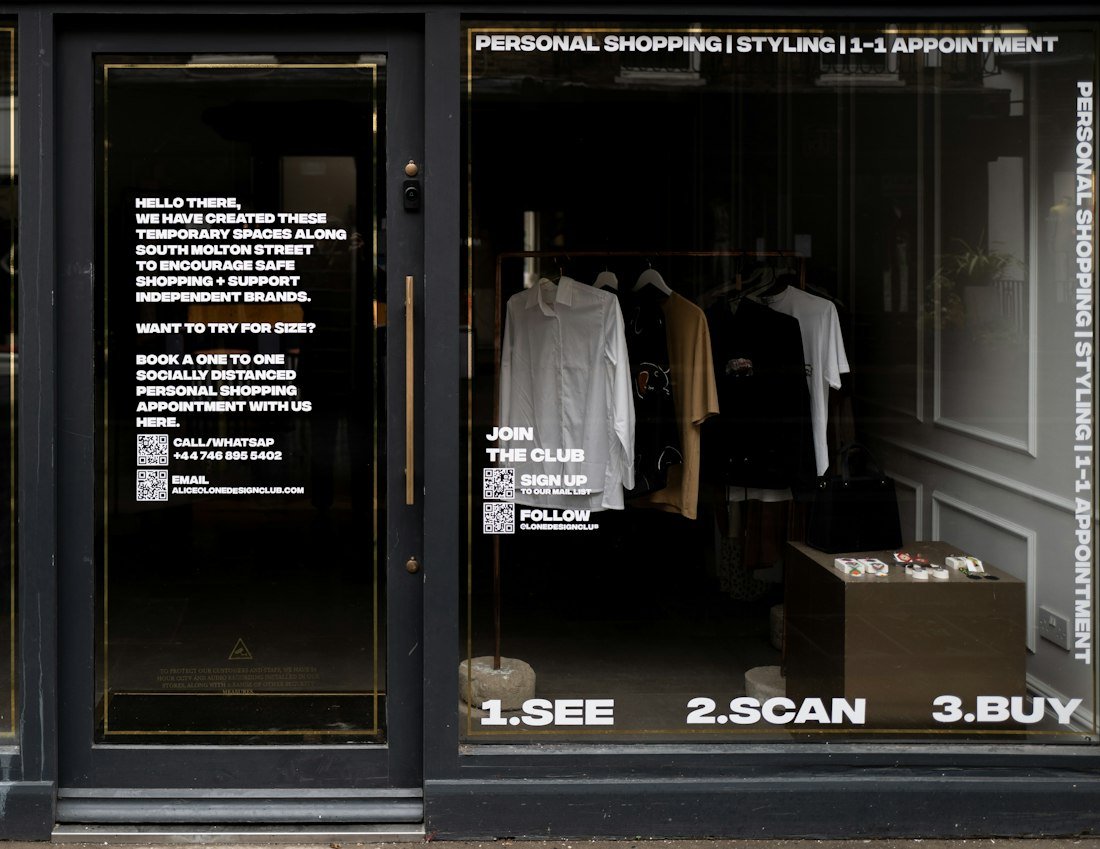 White dress shirt hanging on brown wooden cabinet