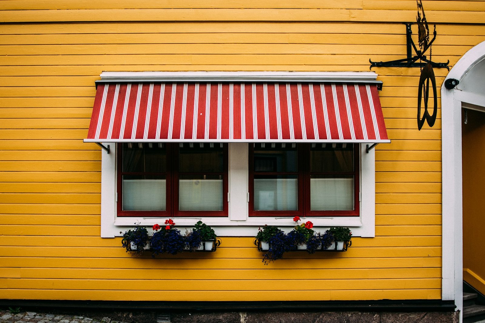 Shop front with a red and white striped awning