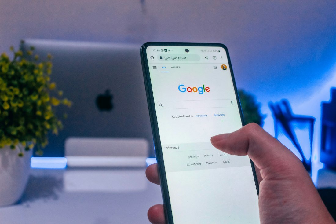 Person holding white android smartphone
