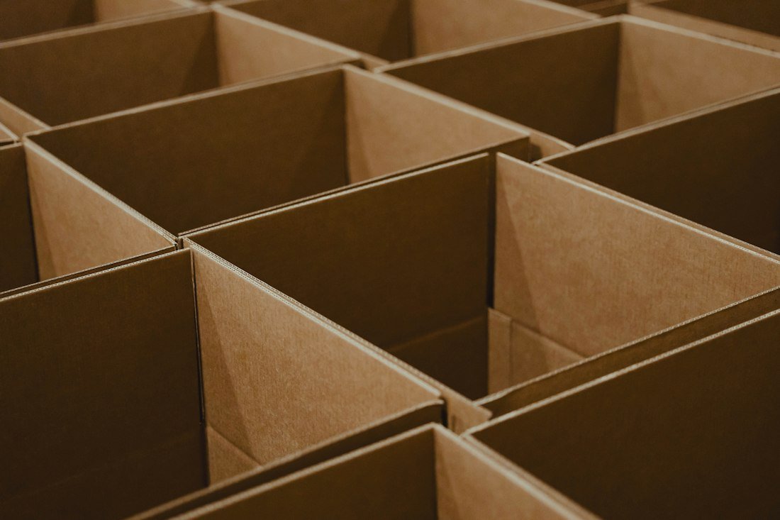 A lot of brown boxes that are open